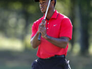 The Associated Press
Tiger Woods did not earn first-place money Monday, but he hit a milestone.