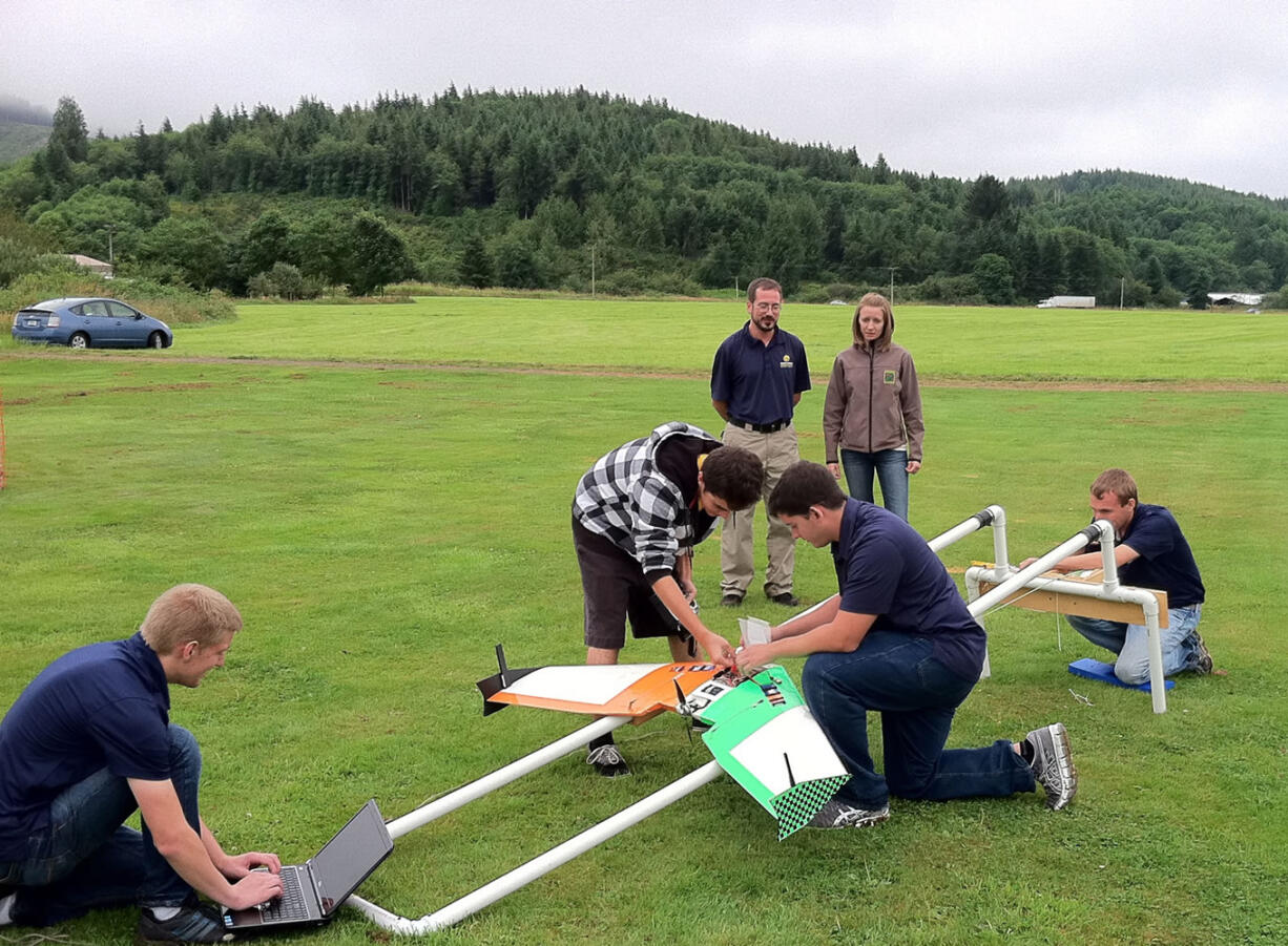 Embry-Riddle Aeronautical University
Students demonstrate the launch catapult for their drone aircraft Thursday near Tillamook, Ore. They had hoped to test the drone's ability to take aerial photographs of cormorants nesting on an offshore rock, but had to scrub the flights for lack of a permit. The Oregon Department of Fish and Wildlife hopes to get the permit in time for nesting season next year.