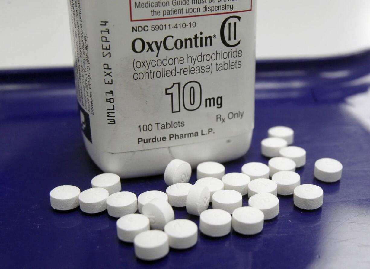 OxyContin pills are arranged for a photo at a pharmacy in Montpelier, Vt.