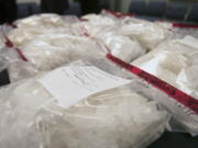 Several bags on methamphetamine sit on display at the Clark County Sheriff's Office headquarters Wednesday. The Clark-Vancouver Regional Drug Task Force seized 74 lbs.