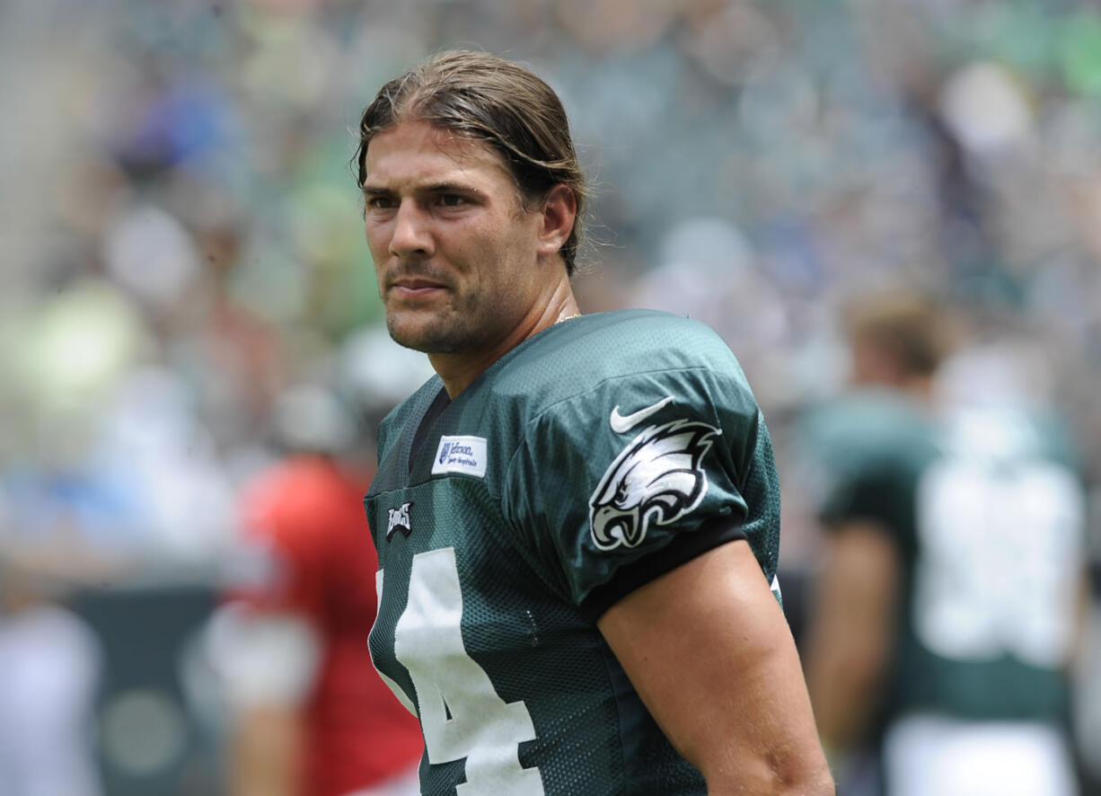 In this Sunday, July 28, 2013, photo, Philadelphia Eagles wide receiver Riley Cooper pauses during the NFL football team's training camp in Philadelphia. Cooper has been fined by the team for making a racial slur at a Kenny Chesney concert that was caught on video, leading him to say he's &quot;ashamed and disgusted&quot; with himself. The video of Cooper making the slur surfaced Wednesday, July 31, on the Internet.