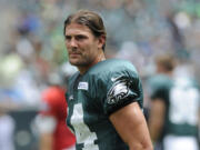 In this Sunday, July 28, 2013, photo, Philadelphia Eagles wide receiver Riley Cooper pauses during the NFL football team's training camp in Philadelphia. Cooper has been fined by the team for making a racial slur at a Kenny Chesney concert that was caught on video, leading him to say he's &quot;ashamed and disgusted&quot; with himself. The video of Cooper making the slur surfaced Wednesday, July 31, on the Internet.