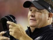 Philadelphia Eagles head coach Chip Kelly winks as he watchers the action on the field during the second half of an NFL football game against the Washington Redskins in Landover, Md., Monday, Sept. 9, 2013.