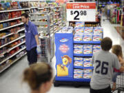 Shoppers peruse the aisles at a Walmart in Bristol, Pa.