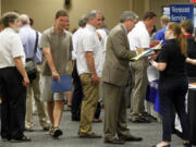 People line up at the job fair  in South Burlington, Vt.  The 162,000 jobs the economy added in July were a disappointment. The quality of the jobs was even worse.