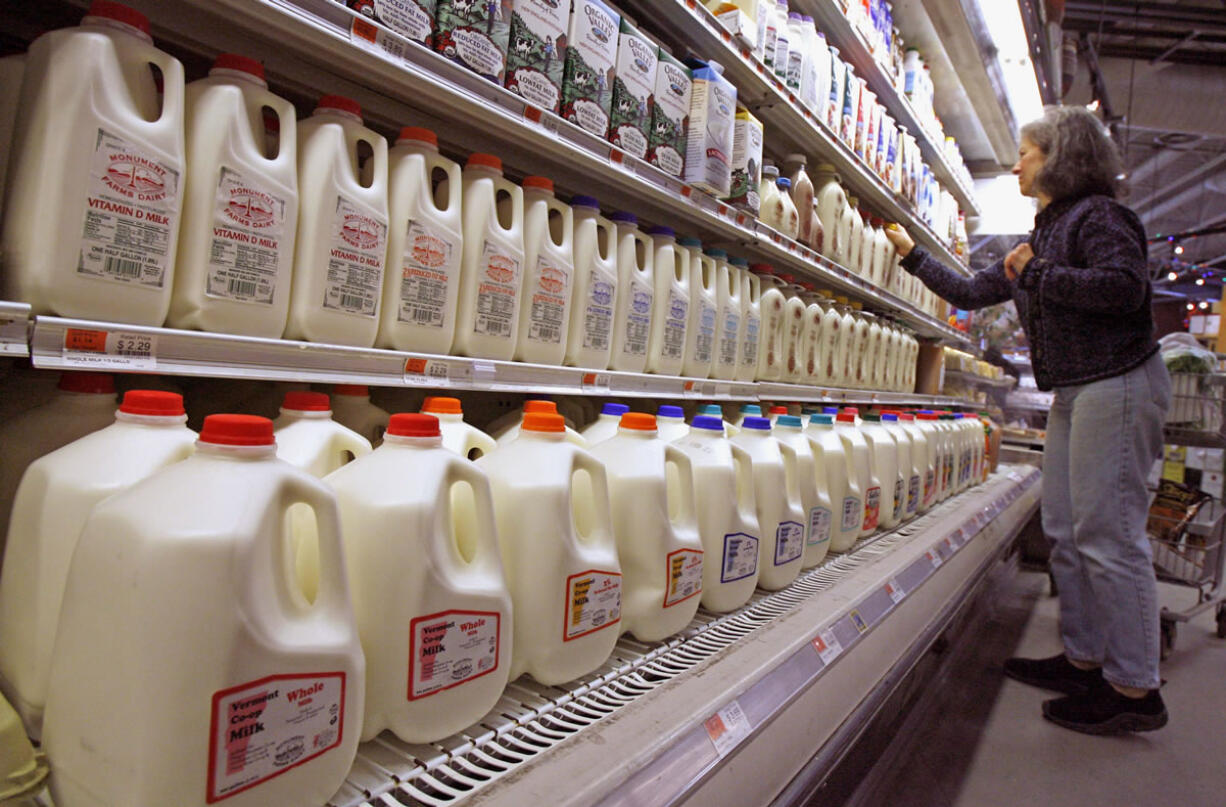 A shopper looks over the milk aisle at the Hunger Mountain Co-op in Montpelier, Vt.