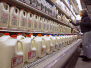 A shopper looks over the milk aisle at the Hunger Mountain Co-op in Montpelier, Vt.