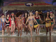 Models wade through the water during the finale of the Tommy Hilfiger Spring 2016 collection during Fashion Week in New York in September.