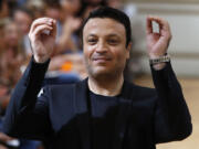 Fashion designer Zuhair Murad gestures at the end of his Haute Couture Fall-Winter 2013-2014 collection show July 4 in Paris.