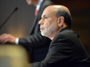 Federal Reserve Board Chairman Ben Bernanke listens to during his introduction at the National Bureau of Economic Research Wednesday, July 10, 2013, in Cambridge, Mass. Bernanke spoke after the markets closed with stocks fluctuating between small gains and losses Wednesday morning, before the Federal Reserve released minutes from its most recent meeting.