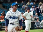 Chadwick Boseman portrays Jackie Robinson in a scene from &quot;42,&quot; by writer-director Brian Helgeland. Remembering Robinson's accomplishments is more important than ever, say people involved with &quot;42&quot; and baseball historians alike.