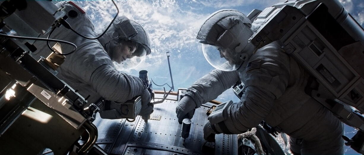 Sandra Bullock, left, and George Clooney in &quot;Gravity.&quot;