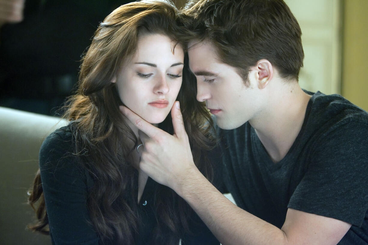 Kristen Stewart, left, and Robert Pattinson in a scene from &quot;The Twilight Saga: Breaking Dawn Part 2.&quot;