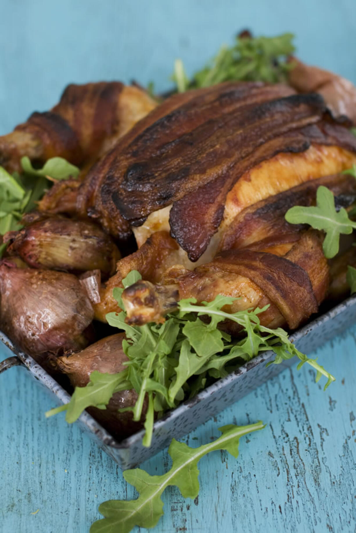 Bacon adds to the intoxicating roasting smells of this chicken dish, which is best served with a green vegetable and lots of fresh, crusty bread.