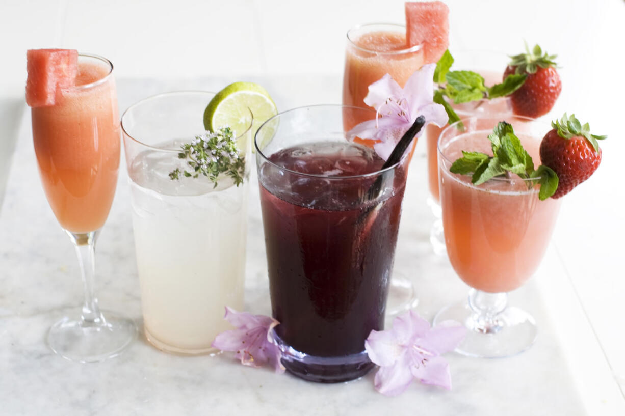 From left: A Watermelon Bellini, White Chiller, Dark Island Cooler, Rose Tinted Glasses wine coolers with a Watermelon Bellini behind them.