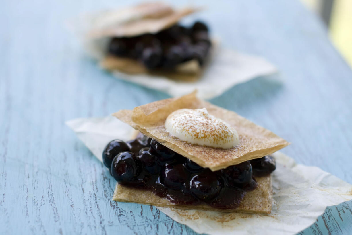 Crisp Blueberry Shortcakes are prepared with three layers of baked phyllo dough cut into squares.