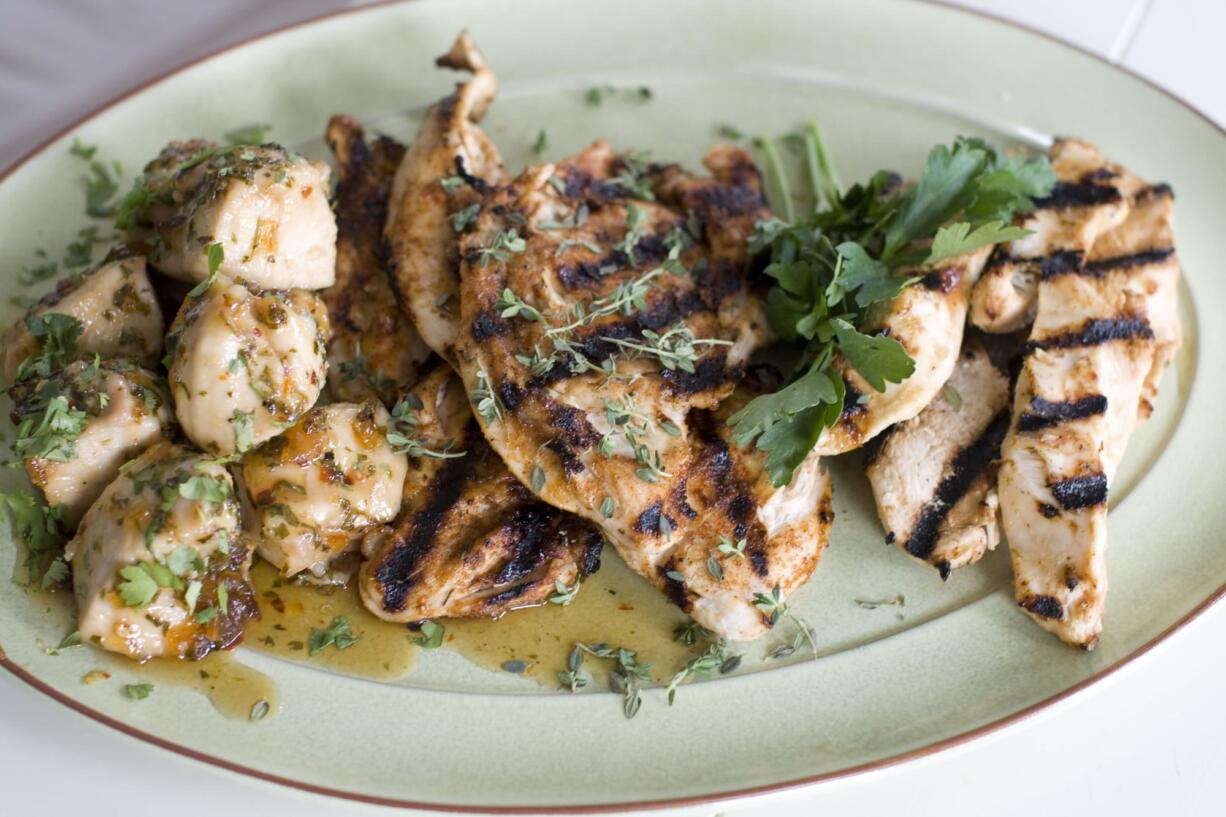 Three types of chicken, from left, a Sticky Orange-Cilantro Smothered Chicken, a Spiced-Rubbed Chicken Breast and Miso-Lime Marinated Chicken Strips