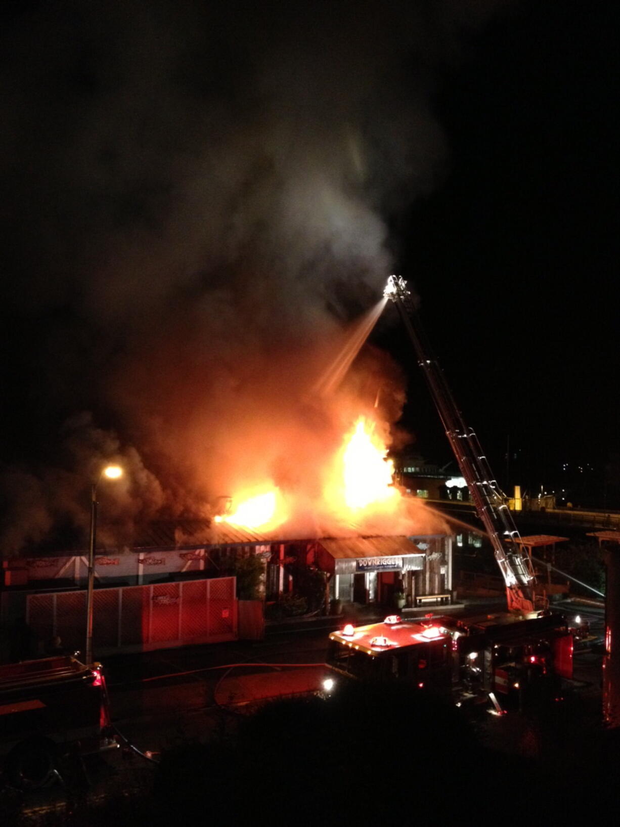 Crews work early Saturday to douse a fire that gutted the popular Downriggers Restaurant and tourism businesses on the picturesque waterfront in Friday Harbor.