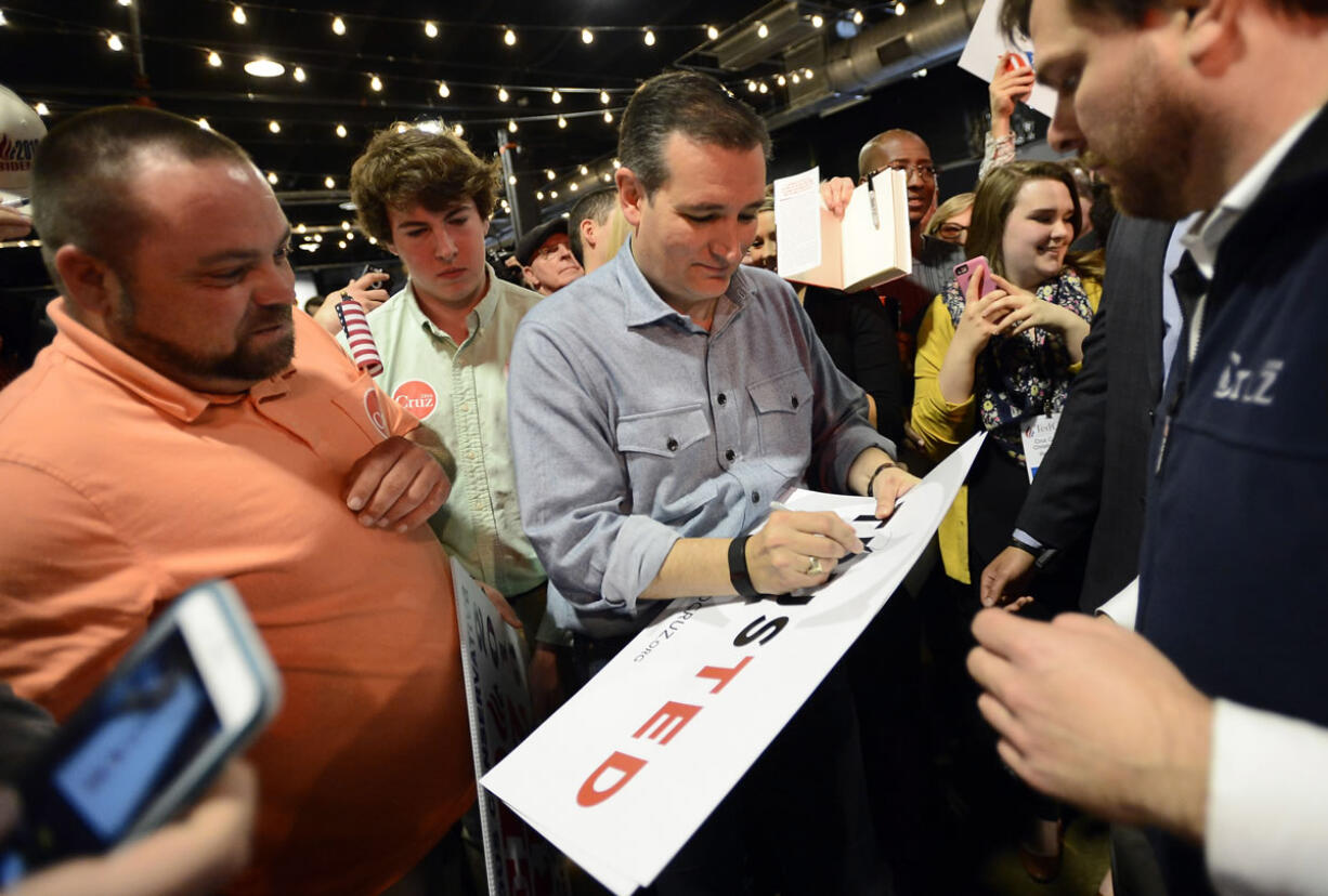 Republican presidential candidate Sen. Ted Cruz, R-Texas, signs autographs for supporters as he campaigns Tuesday in Nashville, Tenn.