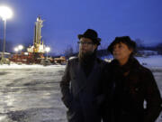 Sean Lennon and actress Susan Sarandon visit a fracking site in New Milford, Pa., in January. Dozens of celebrities may be running afoul of the law as they unite under the banner of one group that is seeking to prevent a method of gas drilling in New York state.