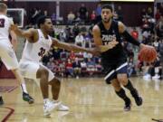 Gonzaga guard Josh Perkins, right, dribbles next to Santa Clara guard KJ Feagin during the second half of an NCAA college basketball game Thursday, Dec. 31, 2015, in Santa Clara, Calif. Gonzaga won 79-77.