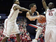 Gonzaga&#039;s Kyle Dranginis, center, passes the ball between Washington State&#039;s Valentine Izundu (45) and Que Johnson during the second half of an NCAA college basketball game, Wednesday, Dec. 2, 2015, in Pullman, Wash. Gonzaga won 69-60.