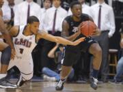 Gonzaga guard Gary Bell Jr., right, gets a steal against Loyola Marymount guard Bruce English.