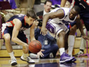 Gonzaga guard David Stockton, left, steals the ball from Portland guard Derrick Rodgers during the first half of an NCAA college basketball game in Portland, Ore., Thursday, Jan. 17, 2013.