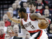 Don Ryan/The Associated Press
LaMarcus Aldridge (12), drives past Memphis' Marc Gasol.