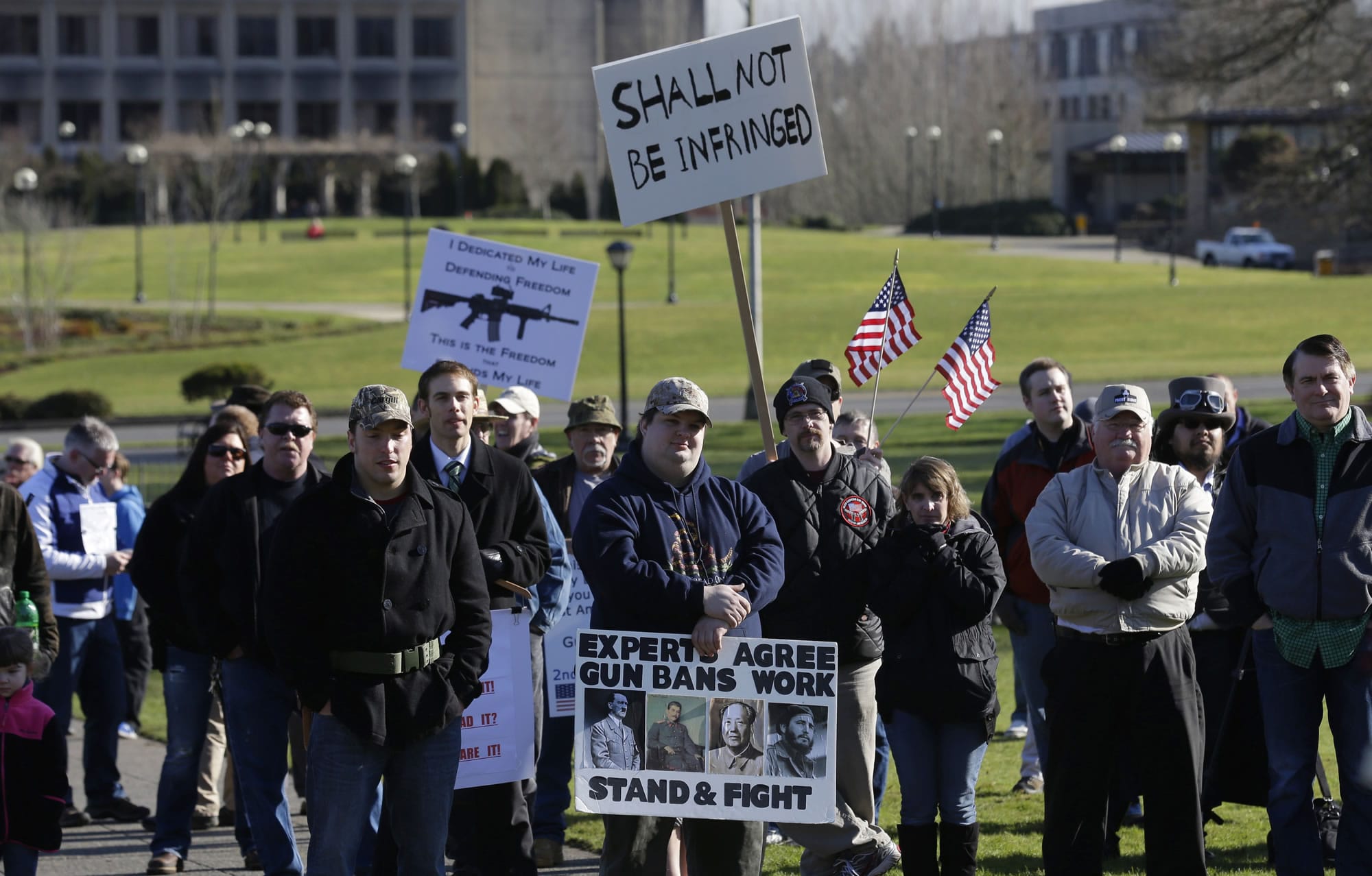 People attending a gun rights rally listen to a speaker Friday at the Capitol in Olympia.