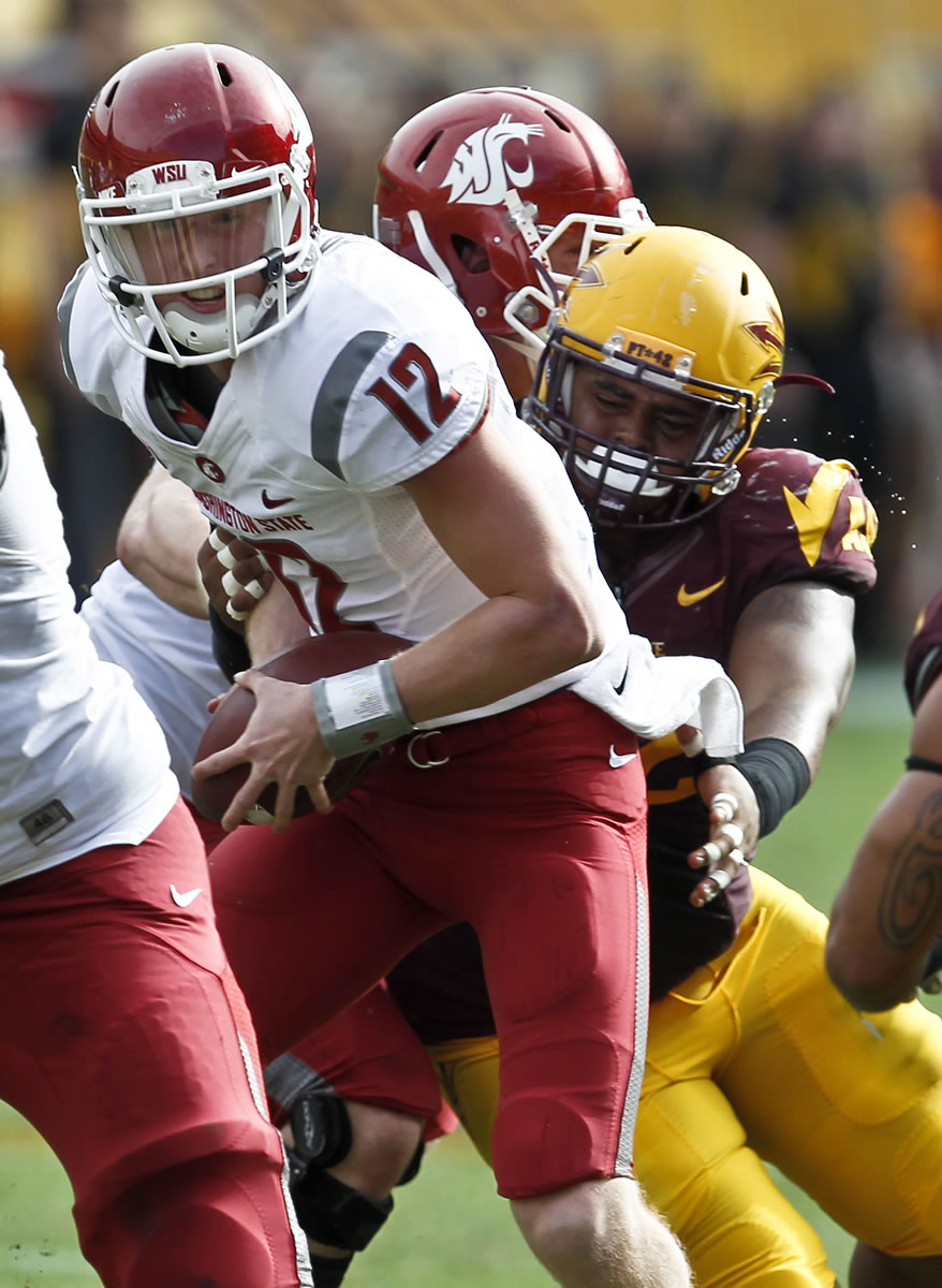 Connor Halliday (12) appeared in nine games for Washington State last season, throwing for 1,874 yards and 15 touchdowns.