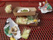 Vegetables left over by students sit on cafeteria trays at the Roosevelt High School in Los Angeles.