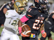 Jess Anders (23) races past Western Hills's Desmond Mize to score one of many Aledo touchdowns Friday.