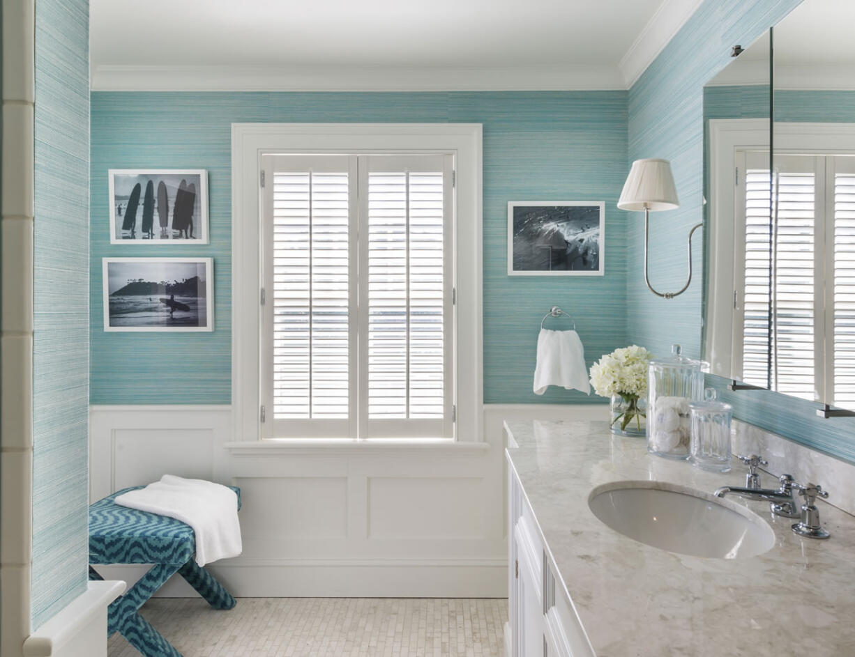 Interior designer Kate Jackson chose a rich, textured wall covering in a mix of blue-green shades that brings a huge dose of style to this simple space. Jackson says the added expense of wallpaper is sometimes a great investment and gift to yourself.