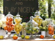 Designer Brian Patrick Flynn suggests grouping fruits in clear glass vessels.