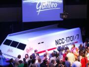 People gather around the restored shuttlecraft Galileo from the 1960s television show &quot;Star Trek&quot; as it is unveiled Wednesday at Space Center Houston.