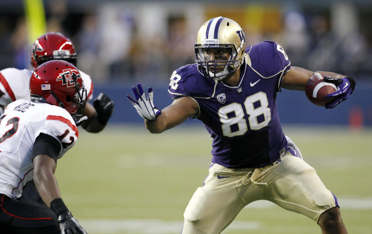 FILE - In this Sept. 1, 2012 file photo, Washington's Austin Seferian-Jenkins (88) defends himself against San Diego State's Josh Wade after a pass reception in the first half of an NCAA college football game in Seattle. Seferian-Jenkins changed his original plea and has pleaded guilty to a charge of driving under the influence stemming from his arrest after crashing his car in March.  Seferian-Jenkins made the guilty plea in Seattle Municipal Court on Monday morning, July 15, 2013, before Judge Fred Bonner.