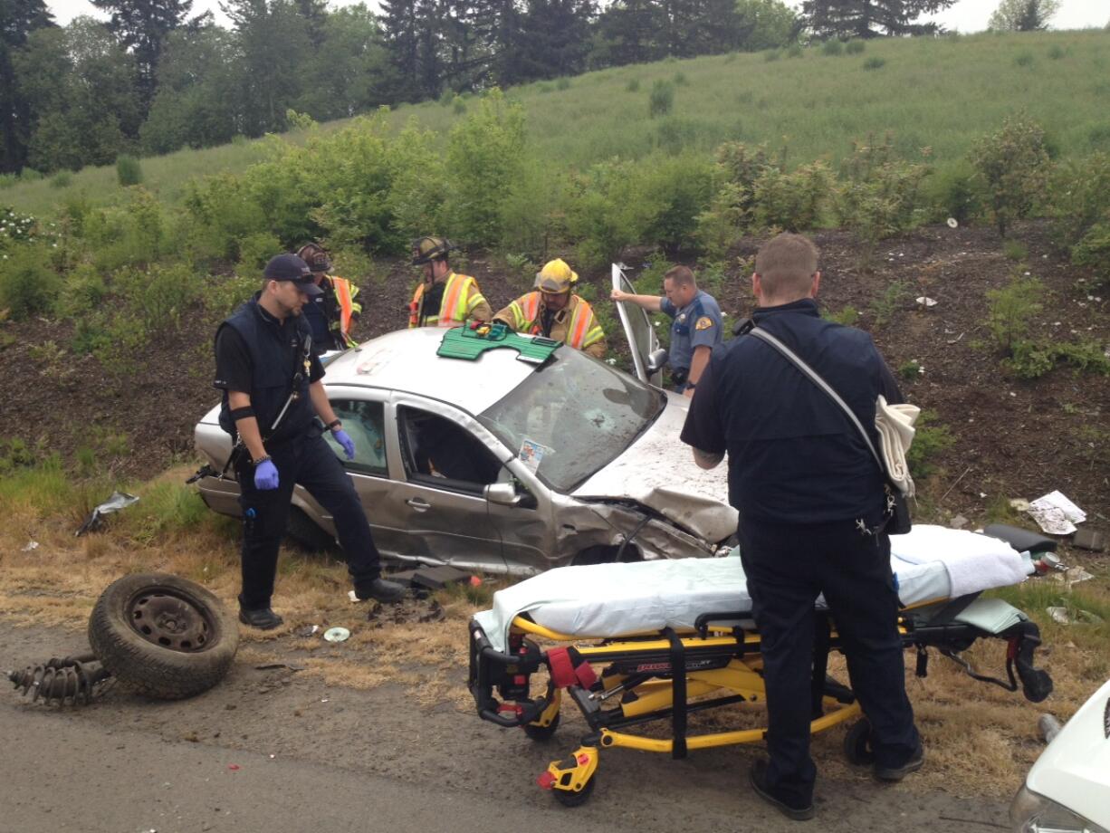 A single-vehicle rollover crash on Interstate 5 near Northeast 219th Street sent at least one person to the hospital.