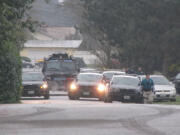 Vancouver police blocked off the 200 block of Southeast 100th Avenue Monday morning and arrested a man suspected of threatening a woman with a firearm.