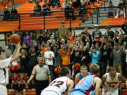 The Panther Pit Crew feels the intensity on their finger tips as Aaron Deister shoots a foul shot.