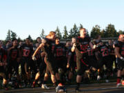 The Camas High School football players complete their pre-game &quot;Haka&quot; dance Friday, at Doc Harris Stadium.