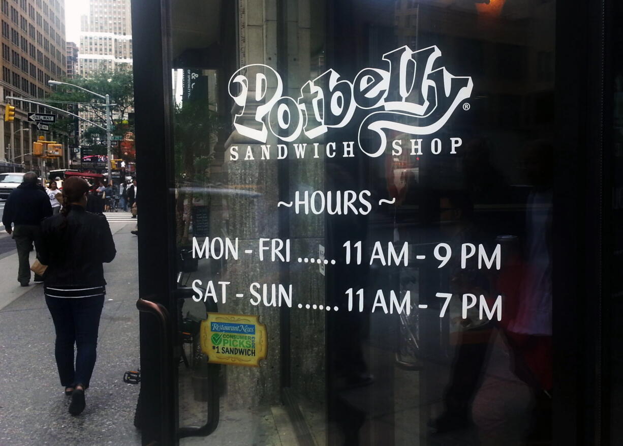 People walk past a Potbelly Sandwich shop in New York.