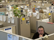 James Finch, service adviser for the US Bank Service Center, takes a call at the facility in Coeur d'Alene, Idaho.