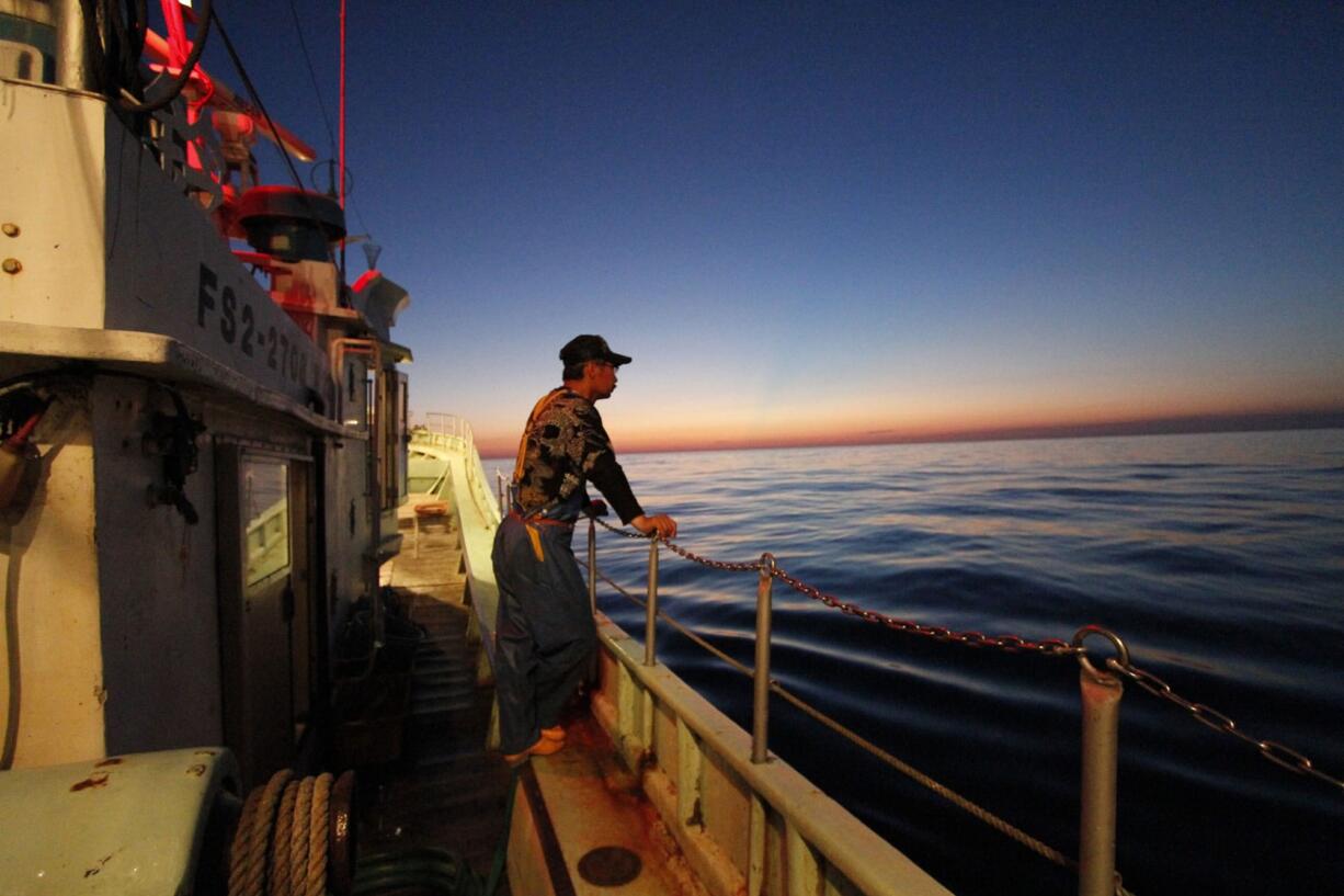 Fisherman Fumio Suzuki stands on his boat Ebisu Maru on Monday before the start of fishing in the waters off Iwaki, about 25 miles south of the tsunami-crippled Fukushima Dai-ichi nuclear power plant, Japan.