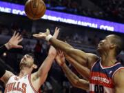 Washington Wizards center Jason Collins, right, battles for a rebound April 17 against Chicago Bulls guard Kirk Hinrich during the first half of an NBA basketball game in Chicago.