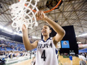 Skyview's Jocelyn Adams cuts down the net after winning the 4A Girls State Basketball Tournament in Tacoma, Saturday, March 3, 2012 Skyview beat Central Valley 46-43.