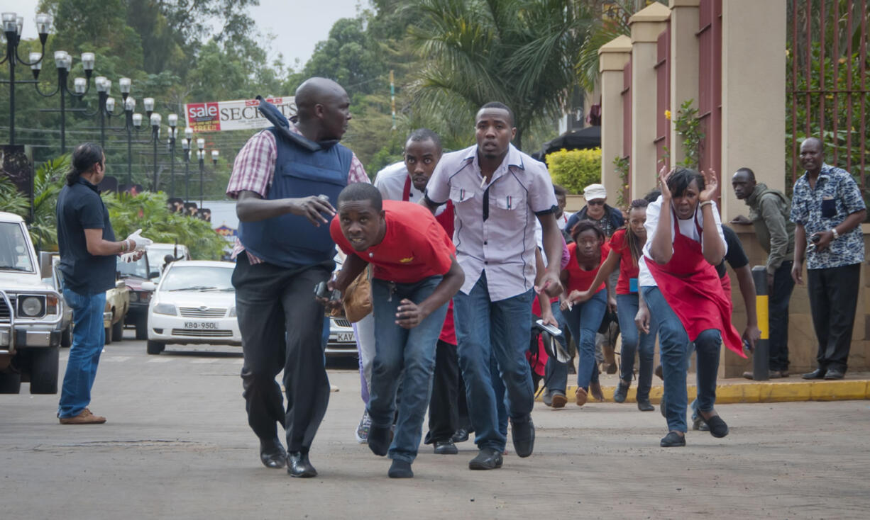 Civilians who had been hiding inside during gunbattles manage to flee from the Westgate Mall in Nairobi, Kenya, on Saturday.