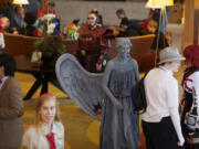 Hilary Beutler, 21, of Clackamas, Ore., is dressed as Weeping Angel from &quot;Doctor Who&quot; at the 2012 Kumoricon in Vancouver.