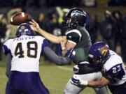 Portland State quarterback Alex Kuresa (7) passes the ball under pressure from Northern Iowa defensive lineman Wyatt Peiffer (48) and linebacker AJ Allen (23) during the second half of a second-round NCAA FCS playoff game on Saturday, Dec. 5, 2015, in Portland, Ore. Northern Iowa won 29-17.