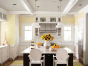 Kansas City Star
Lemon Sorbet by Benjamin Moore can work well in any kitchen. In this kitchen, the pastel yellow is paired with white to highlight all the decorative and architectural accents as well as the dark wood island, offering balance and contrast.